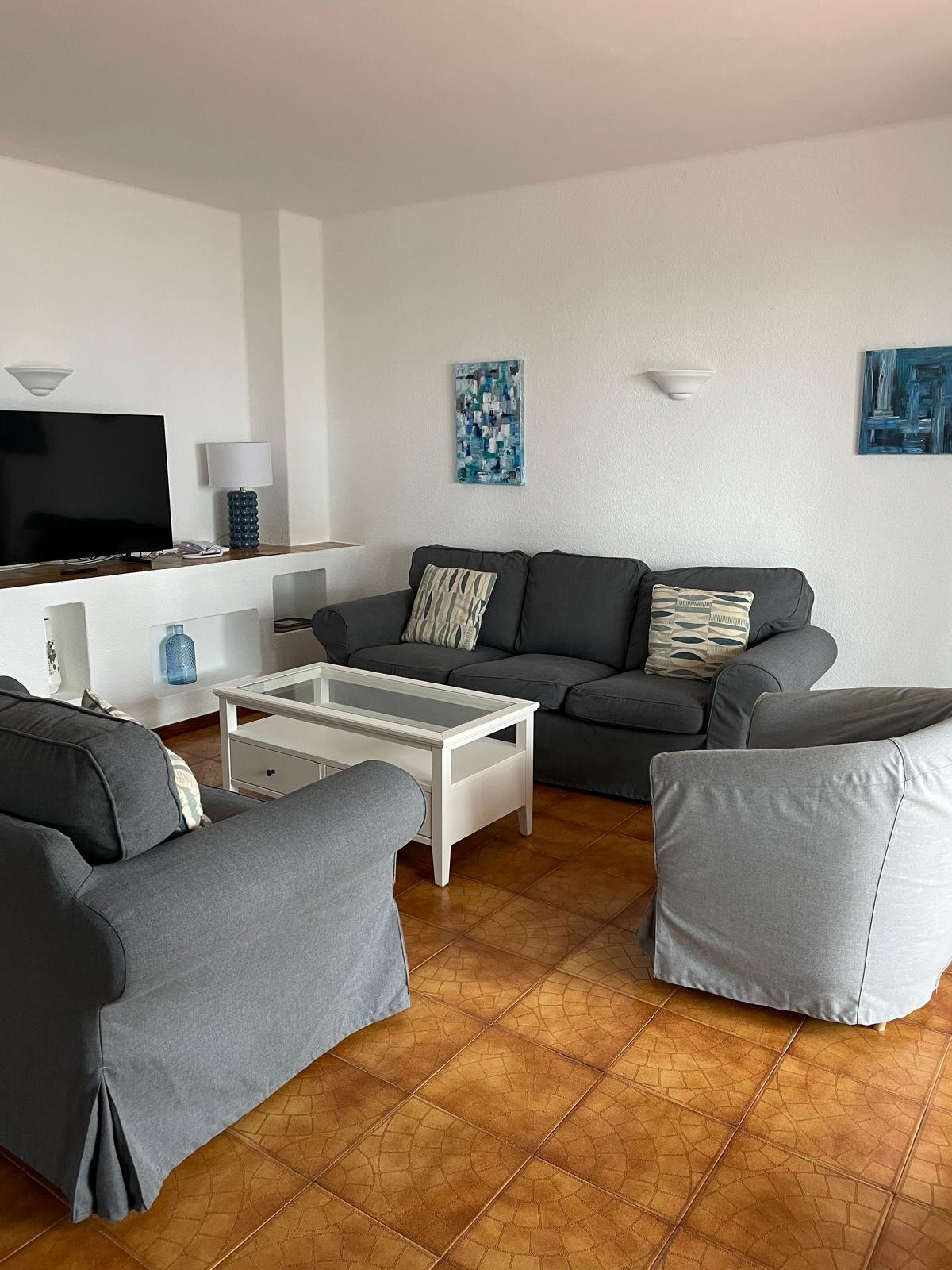 Villa 73 lounge with sofas and TV
