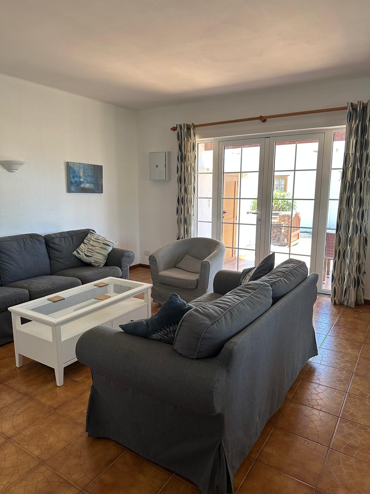 Villa 75 lounge with patio doors to the terrace